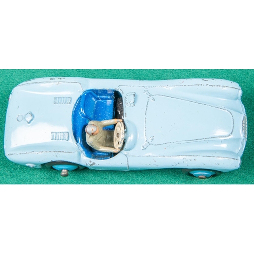 309 - 4 Dinky Toys. 2x Jaguar XK120 in dark green with light brown wheels and in turquoise and cerise with... 