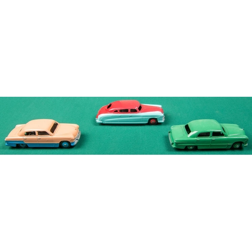 316 - 3 Dinky Toys American cars. A Ford Sedan, a low-line example in pink and blue with blue wheels. Anot... 