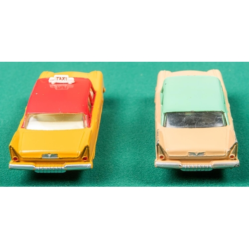 321 - 2 Dinky Toys Plymouth Plaza. A U.S.A. TAXI (265) in orange and red with cream interior, TAXI to roof... 