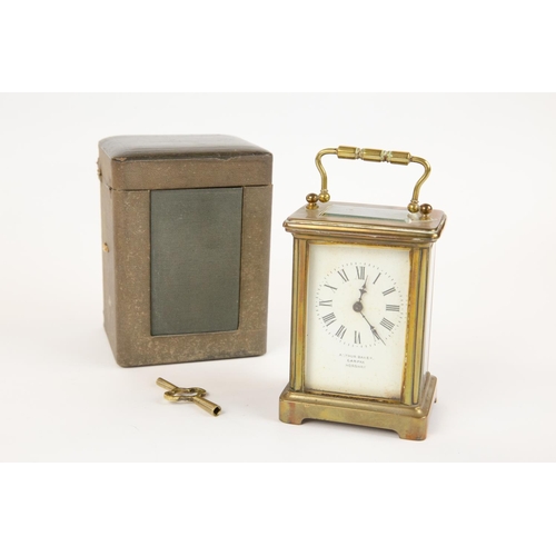 15 - A brass cased carriage clock, by Arthur Baker, Carfax, Horsham, with carrying handle, GC and appears... 