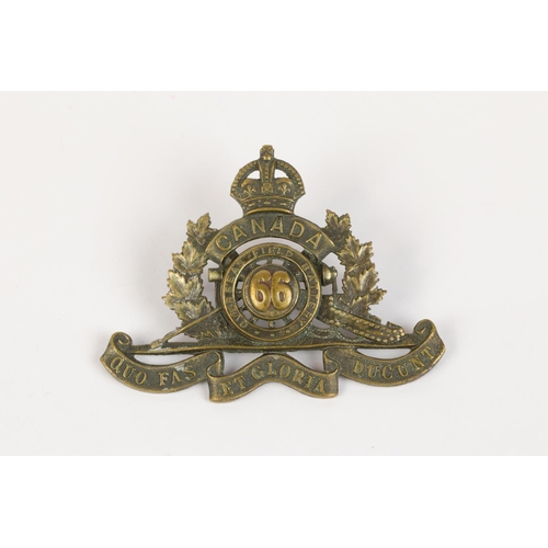 163 - WWI CEF cap badge of the 66th Overseas Field Battery Canadian Field Artillery, with two brass lugs. ... 