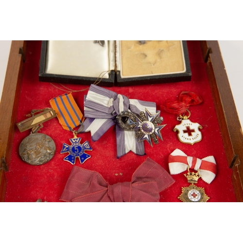 29 - An interesting assemblage of awards etc, loosely tie mounted on display board, comprising: MBE, 2nd ... 