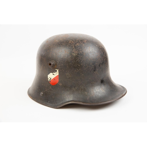 84 - A German 1918 pattern steel helmet, with Third Reich Army decals (worn), and remains of the leather ... 