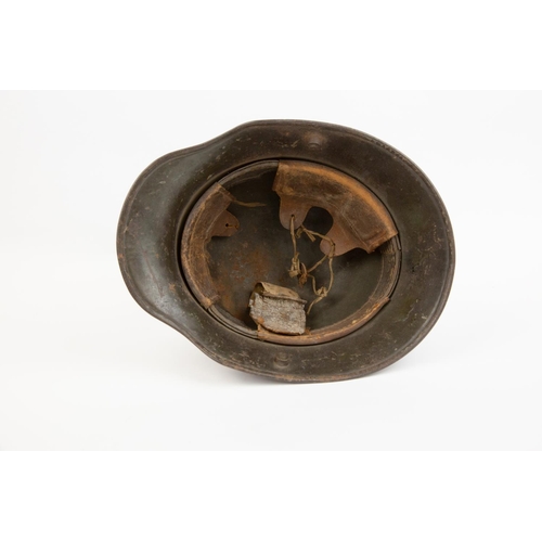 84 - A German 1918 pattern steel helmet, with Third Reich Army decals (worn), and remains of the leather ... 