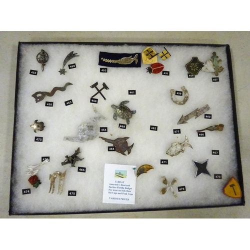 71 - A frame of assorted Third Reich U-Boat and Surface Flotilla badges, generally GC £200-250