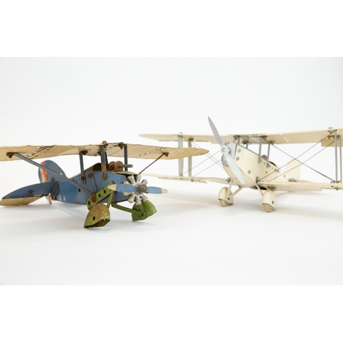 103 - 2 Meccano tinplate aeroplanes. Made up as a single engine Bi-Plane in cream and grey, complete with ... 