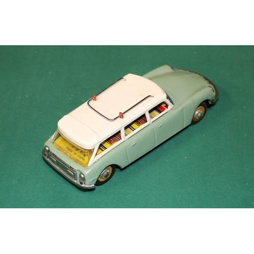 153 - A scarce early 1960's SFTF tinplate 1:24 scale friction powered model of a Citroen ID19 DS Safari. I... 