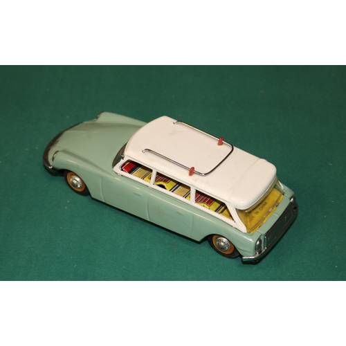 153 - A scarce early 1960's SFTF tinplate 1:24 scale friction powered model of a Citroen ID19 DS Safari. I... 