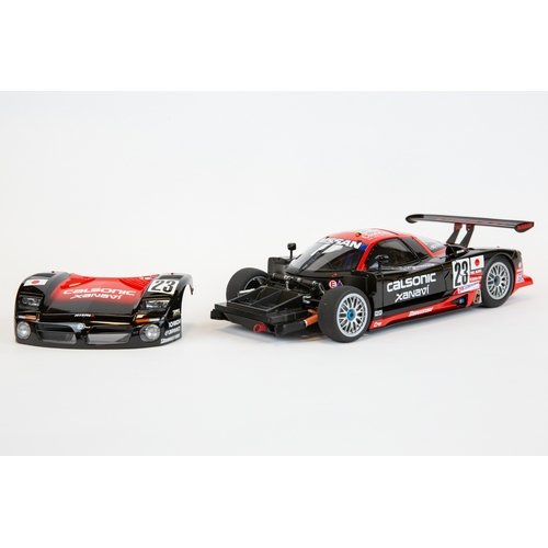 193 - A 1:18 Autoart Signature series Nissan R390 GT1 #23 Le Mans 1997. In black and red racing livery, dr... 