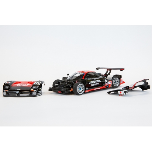 193 - A 1:18 Autoart Signature series Nissan R390 GT1 #23 Le Mans 1997. In black and red racing livery, dr... 