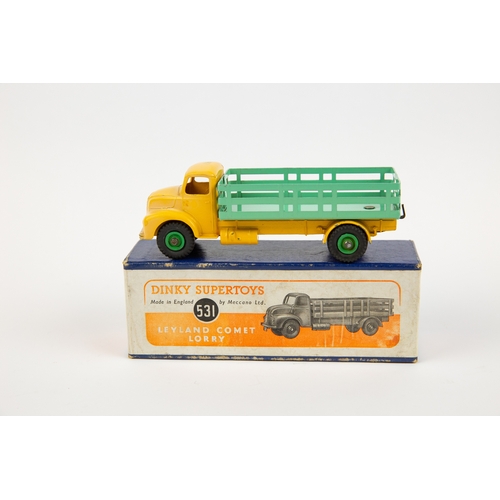 322 - 2 Dinky Toys. A Supertoys Leyland Comet Lorry (531). Example with yellow cab and chassis, pale green... 