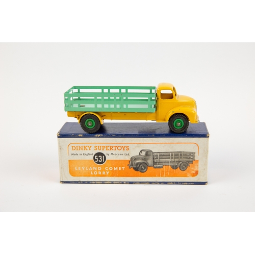 322 - 2 Dinky Toys. A Supertoys Leyland Comet Lorry (531). Example with yellow cab and chassis, pale green... 