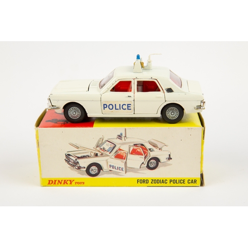 325 - 2 Dinky Toys POLICE Cars. Ford Zodiac (255) in white with red interior and dark metallic grey base, ... 