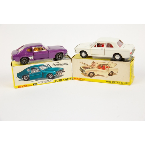 327 - 2 Dinky Toys. Ford Cortina (159). In white with red interior, with smooth spun wheels. Plus a Ford C... 