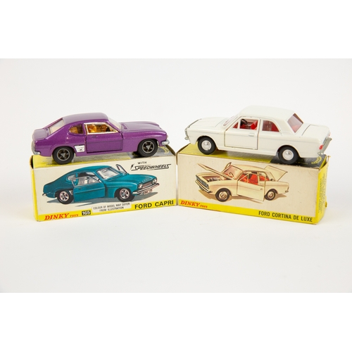 327 - 2 Dinky Toys. Ford Cortina (159). In white with red interior, with smooth spun wheels. Plus a Ford C... 