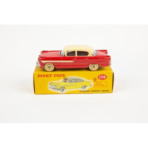 330 - 2 Dinky Toys. Nash Rambler (173). In pink with mid blue flash and cream wheels. Plus a Hudson Hornet... 