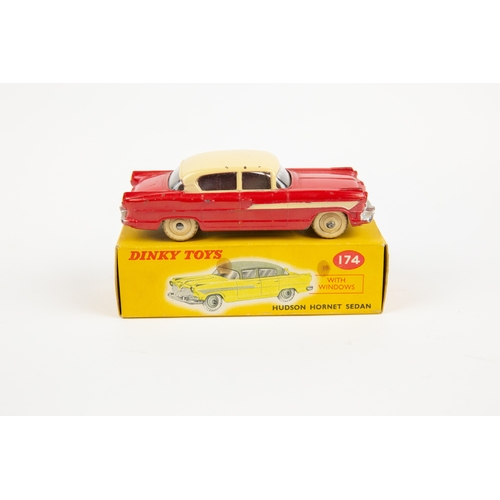 330 - 2 Dinky Toys. Nash Rambler (173). In pink with mid blue flash and cream wheels. Plus a Hudson Hornet... 