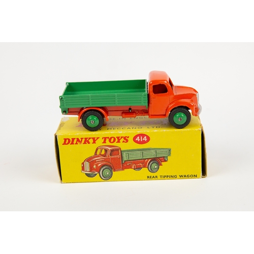 338 - 2 Dinky Toys. Dodge Rear Tipping Wagon (414). An example with orange cab and chassis, with mid green... 