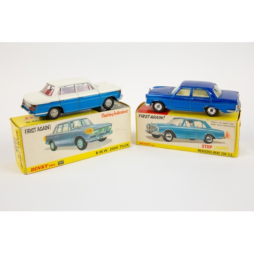 343 - 2 Dinky Toys. B.M.W. 2000TiLux (157). In metallic blue and white with red interior, with battery pow... 