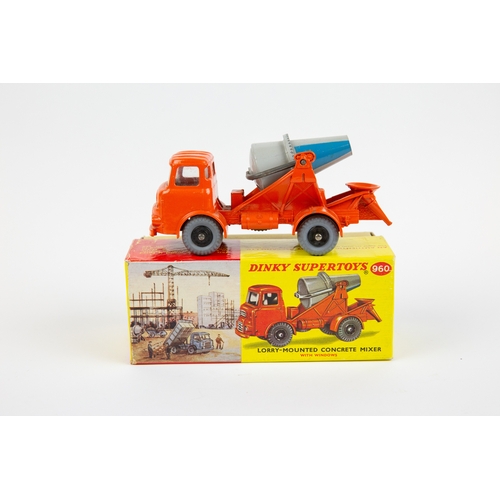 354 - A Dinky Toys Lorry Mounted Cement Mixer (960). An Albion in orange with grey and blue rotating mixer... 