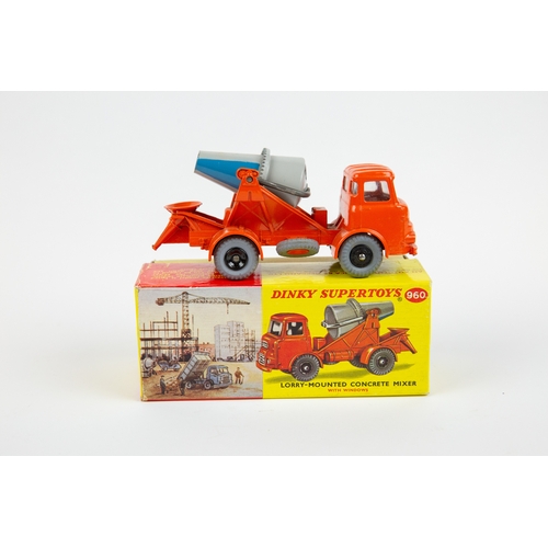 354 - A Dinky Toys Lorry Mounted Cement Mixer (960). An Albion in orange with grey and blue rotating mixer... 