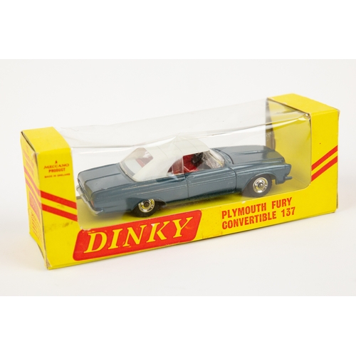 359 - A rare American export Dinky Toys Plymouth Fury Sports (115). In off white with red interior, comple... 