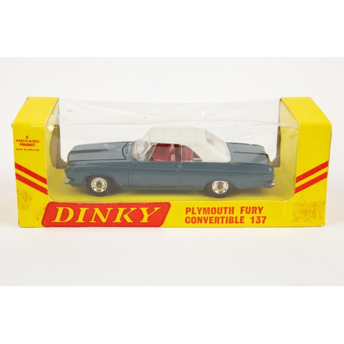 359 - A rare American export Dinky Toys Plymouth Fury Sports (115). In off white with red interior, comple... 