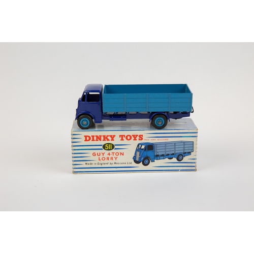 375 - Dinky Toys Guy 4-Ton Lorry (511). Cab and chassis in violet blue with mid blue body and wheels. Boxe... 