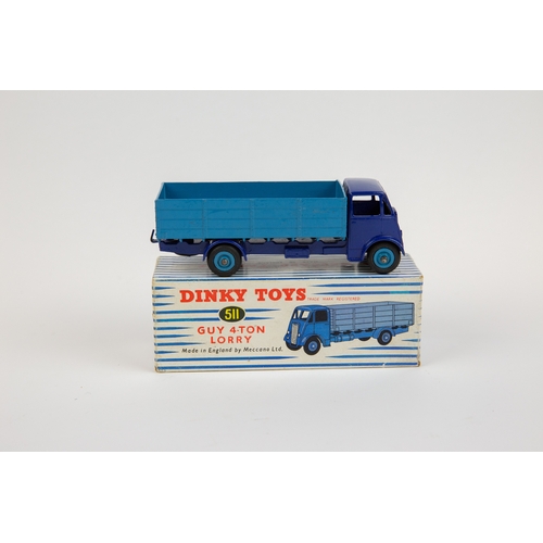 375 - Dinky Toys Guy 4-Ton Lorry (511). Cab and chassis in violet blue with mid blue body and wheels. Boxe... 