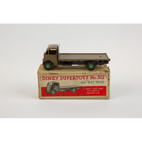 392 - Dinky Supertoys Guy Flat Truck (512). A scarce very early example in khaki cab and flatbed with blac... 