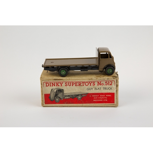 392 - Dinky Supertoys Guy Flat Truck (512). A scarce very early example in khaki cab and flatbed with blac... 