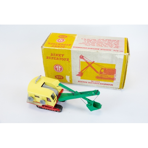 397 - Dinky Supertoys Ruston Bucyrus Excavator (975). Pale yellow plastic body, green jib and bucket, red ... 