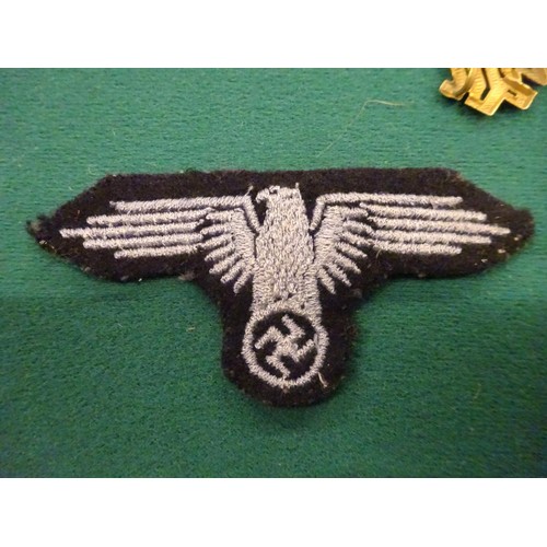 75 - Third Reich SS insignia: embroidered breast eagle, woven cap eagle, silver bullion embroidered cuff ... 