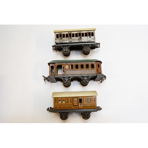 43 - 3 small German for the U.K. market tinplate 4 wheeled coaches. 2 by BING, a GWR 1st/3rd with opening... 