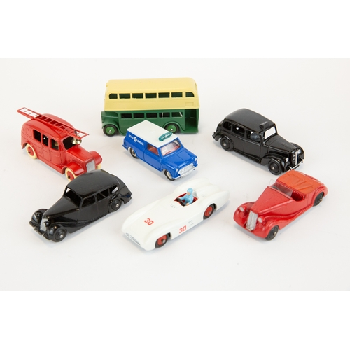 325 - 7 well restored early Dinky Toys. A Leyland Double Deck Bus, Austin FX3 TAXI, Streamlined Fire Engin... 