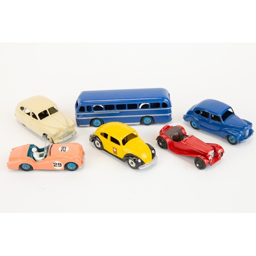 334 - 6 Dinky Toys. Duple Roadmaster Coach in dark blue, Standard Vanguard in cream, Austin Devon in dark ... 