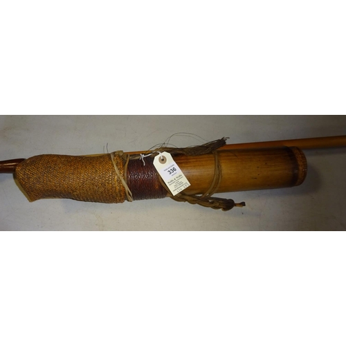 309 - A Dyak blowpipe, together with an ornamental wooden dart quiver. GC £50-60