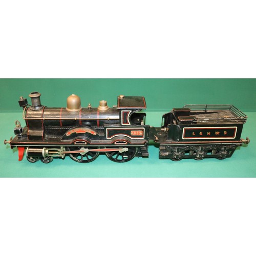 35 - A rare Bing gauge 3 spirit fired L&NWR 4-4-0 tender locomotive. C.1902. Locomotive 39cm, 6 wheeled t... 