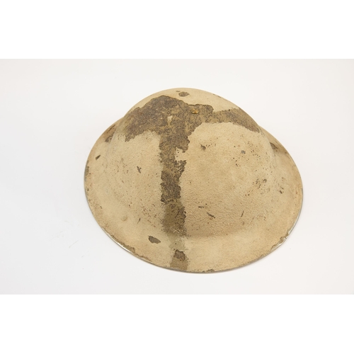 222 - A British WWII Mk 2 steel helmet, the skull with textured desert camouflage finish and painted Royal... 