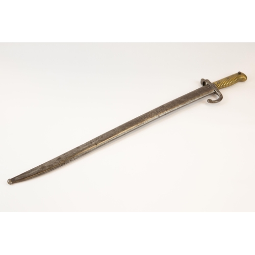 270 - A brass hilted Chassepot type bayonet for the Remington rifle, the blade with knight's head mark, in... 