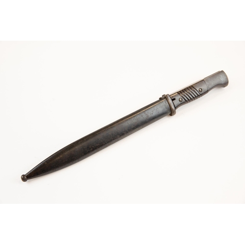 100 - A Third Reich K98 bayonet, by Carl Eickhorn, with bakelite grip, in its scabbard dated 1939, the bla... 