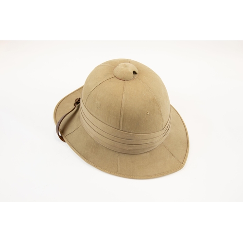 224 - A khaki tropical helmet, probably 1940s, with leather lining and chinstrap. GC £60-80