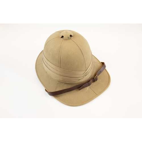 224 - A khaki tropical helmet, probably 1940s, with leather lining and chinstrap. GC £60-80