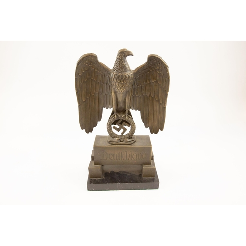 56 - A large Third Reich bronzed brass standing eagle, on a rectangular base inscribed 