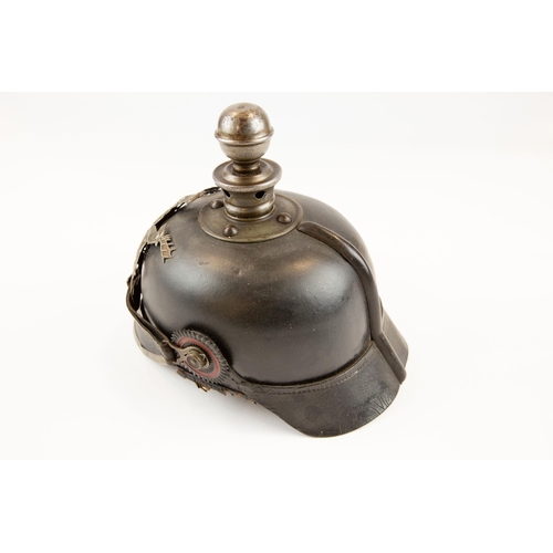 74 - A WWI Wurttemberg Artillery Pickelhaube, with iron badge, ball top and mounts, and with chinstrap an... 