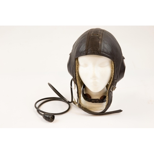 78 - A good scarce WWII German fleece lined black leather flying helmet, with Siemens label, integral ear... 