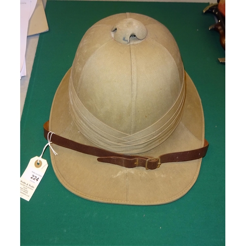 224 - A khaki tropical helmet, probably 1940s, with leather lining and chinstrap. GC £60-80