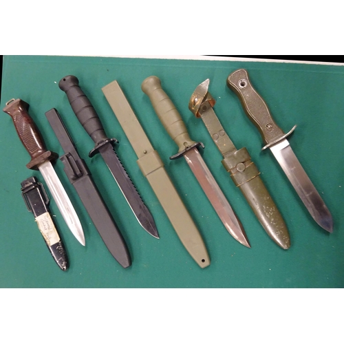 306 - A Wilkinson survival knife c 1970, 2 German combat knives; 2 other Continental survival knives. All ... 