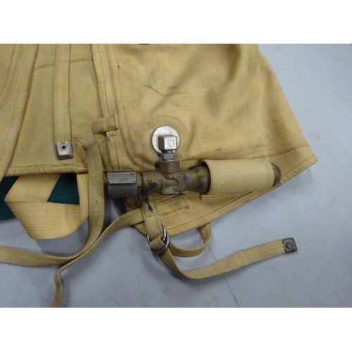 80 - A good WWII Battle of Britain era German Luftwaffe life jacket, with compressed air bottle, and make... 