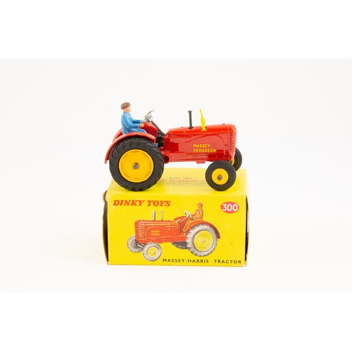 412 - Dinky toys No.300 Massey Harris tractor. Bright red body, large diecast rear wheels with rubber tyre... 